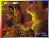 Cat by a decorated Christmas tree with a glowing effect and a quote from Truman Capote.